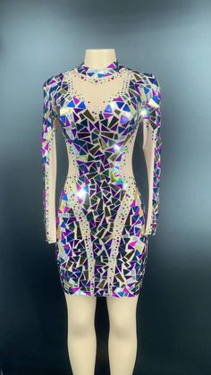 a mannequin wearing a dress with colorful sequins on it's body