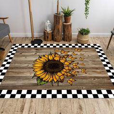 a sunflower on a wooden floor with checkered pattern