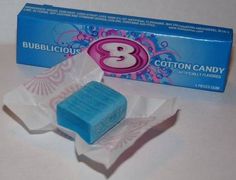 a blue and white soap bar next to a box of cotton candy