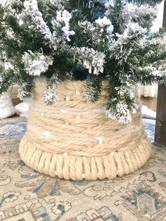 a basket filled with snow covered pine branches