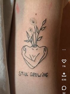 a tattoo on the arm that says still growing