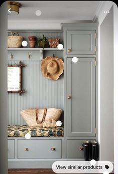 a room with some gray cabinets and hats on it