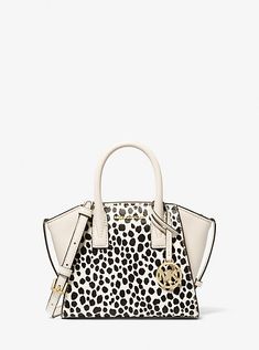 Equally versatile and sophisticated, our Avril satchel is a must-have addition to your handbag lineup. Crafted from printed calf hair and leather, this gusseted design opens to a pocketed interior and features a detachable crossbody strap for versatility of wear. It’s the perfect complement to office-ready looks and casual weekend wear alike. Cheetah Print Hair, Small Cow, Michael Kors Satchel, Hair Trim, Black Satchel, Michael Kors Outlet, Leather Satchel Bag, Casual Weekend, Michael Kors Collection