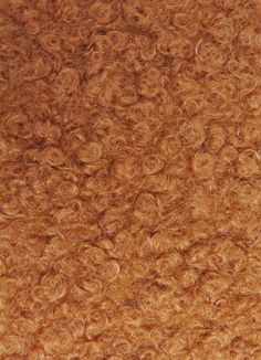 a close up view of the texture of an animal's fur that is brown