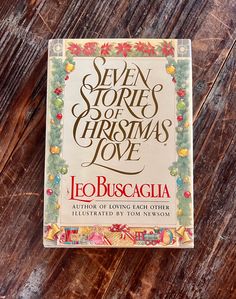 the book seven stories of christmas love by leo busacia on a wooden surface