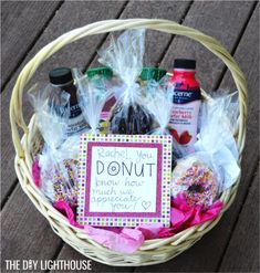 a basket filled with donuts and condiments on top of a wooden table