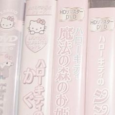 several pink books with hello kitty characters on them