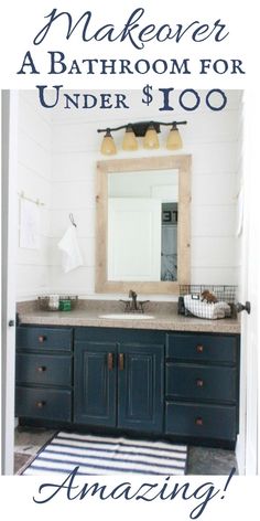 a bathroom with blue cabinets and white walls