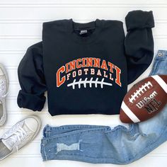 Show off your love and support for the Bengals with this unisex crewneck sweatshirt! This trendy football sweatshirt is pure comfort and is sure to become your new favorite or the perfect gift for the Bengals fans in your life! These shirts are made with  cotton and polyester so they are extra soft and won't lose their shape after being dried.  SIZING - Unisex adult sizing - Relaxed fit - Runs true to size CARE INSTRUCTIONS: * Machine wash: warm (max 40C or 105F) * Tumble dry: low heat * Do not Football Fan Shirts, Sunday Football, Football Sweatshirt, Stitch Shirt, Womens Football, Football Fans, Cincinnati, San Jose, Crewneck Sweatshirt