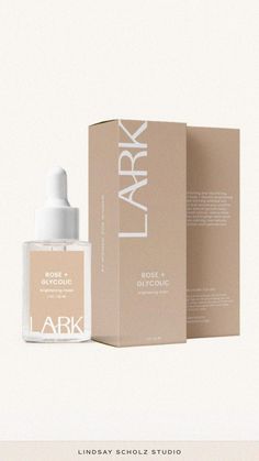 a bottle of lark root celling cream next to a cardboard box on a white background