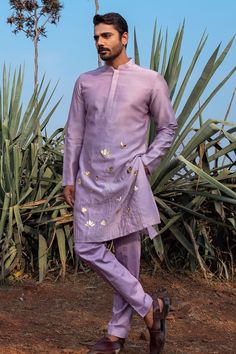 Buy Purple Kurta Chanderi Silk Hand Embroidered Lotus Kingdom Set For Men by Runit Gupta Online at Aza Fashions. Lilac Mens Wedding Attire, Handpainted Mens Kurta, Pleated Kurta For Men, Lilac Kurta For Men, Sangeet Kurta For Men, Lilac Indian Outfit, Sangeet Outfit Men, Purple Kurta For Men, Silk Kurta For Men