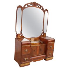 an antique wooden dresser with mirror on top