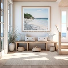 a living room with a bench and large window overlooking the beach in front of it