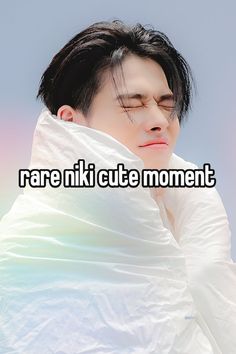 a man wrapped in a blanket with the words rare niki cute moment