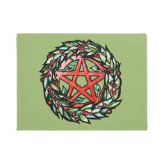 a red pentagramil surrounded by holly leaves and berries on a green background with an olive wreath