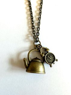 Kettle and Clock Wonderland Necklace. Alice in Wonderland inspired  charm with 20 inch necklace. Bronze tone finish. Alice In Wonderland Inspired, 20 Inch Necklace, Fantasy Adventure, Charleston Sc, Alice In Wonderland, Charleston, Pendant Necklaces, Favorite Jewelry, Jewelry Necklace Pendant