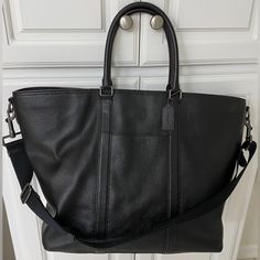 Coach Genuine Pebbled Extra Large Leather Travel Tote Black - 17.5” W X 6” D X 16.5” T, Heavy Duty Hardware, Handles Plus Wide Shoulder Strap, Zip Top, Luggage Handle Sleeve On Back, Pocket On Front And Zippered Pocket On Back, And Zippered Pocket On Side, Multiple Pockets Inside - Only Used Twice, Was Too Big For My Taste, My Loss Is Your Gain On This One, You Won’t Be Able To Tell It Isn’t Brand New- Incredible Quality And Heavy Duty Premium Leather Coach Pebbled Leather Bag For On-the-go, Luxury Top Handle Bag With Pebbled Texture, Luxury Rectangular Bag With Pebbled Texture, Luxury Formal Bags With Pebbled Texture, Classic Top Handle Bag With Pebbled Texture, Pebbled Leather Bag With Leather Backing For Daily Use, Luxury Crossbody Bags With Pebbled Texture, Classic Bags With Pebbled Texture And Top Handle, Luxury Shoulder Bag With Pebbled Texture For Daily Use