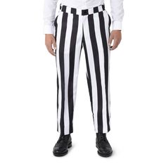 a man in black and white striped pants is standing with his hands on his hips