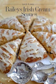 a close up of a pastry on a plate with spoons next to it and the title says bailey's irish cream scones