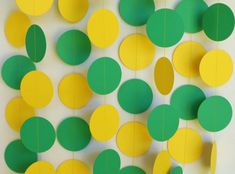 green and yellow paper circles hanging from strings