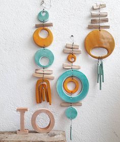 an assortment of wooden objects hanging on a wall