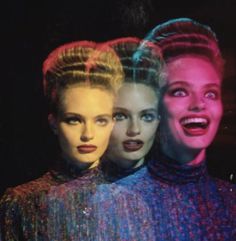 three women with different hair styles and makeup are posing for a photo in front of neon lights