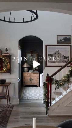 the hallway is decorated for christmas with wreaths and garland on the bannisters