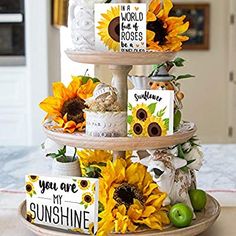 a three tiered cake with sunflowers on it and cards that say you are my sunshine