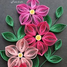 the paper flowers are made to look like they have been cut out and put together