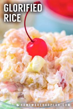 a close up of a bowl of food with a cherry on the top and other items in the background