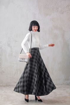 "This winter wool skirt is a classic piece of tailoring that will see you through rain or shine. It is cut with a flattering flared skirt to give you a wonderful shape. The winter skirt is perfect classic styling and ends at the ankle. This is a versatile skirt that you'll wear again and again. DETAILS: * More colors available https://etsy.me/2WgHgmy * 30% wool, 30% fiber, 40% polyester * fully satiny liner * Two side pockets * Right zip closure * A litter Back elastic, comfortable wear * Plus s Classic Long Winter Skirt, Classic Long Skirt For Winter, Winter Maxi Skirt For Workwear, Wool Flowy Lined Skirt, Long Flowy Wool Skirt, Wool Lined Flowy Skirt, Relaxed Fit Wool Full Skirt, Wool Full Skirt With Lining, Relaxed Wool Full Skirt