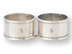 two silver rings with numbers on them