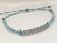 "This is an engraved waterproof bracelet, It is shown with an engraved brushed stainless steel bar and mint straps. You can choose your metal color and strap color. The bar will be engraved with \"Sisters in Christ\". You can choose back side engraving for personalization during checkout. Please let us know if you have any questions! The back can also be engraved. CHARACTER LIMIT- 14 characters per side Each item is made-to-order, which gives our pieces a unique meaning that is specific and spec Adjustable Engraved Name Bracelet For Friendship, Adjustable Name Bracelet With Engraved Text As Gift, Adjustable Stainless Steel Name Bracelet With Engraving Option, Adjustable Stainless Steel Bracelets With Engraved Text, Inspirational Engraved Adjustable Name Bracelet, Adjustable Stainless Steel Bracelet With Engraved Text, Inspirational Engraved Name Bracelet, Adjustable, Adjustable Silver Name Bracelet With Engraved Text, Adjustable Stainless Steel Bracelet With Laser Engraving