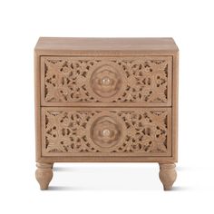 an intricately carved wooden cabinet with two drawers on one side and a drawer on the other