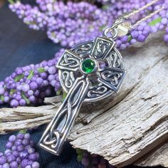 Solid sterling silver Celtic Cross Pendant with emerald cubic zirconia on your choice of chain length This beautiful solid sterling silver Celtic Cross incorporates the Celtic knot work in a lovely classic Celtic weave design...a unique piece that will be loved for a lifetime. 1 1/2" x 3/4" solid sterling silver pendant comes on a sterling silver chain. Hallmarked 925 on back of pendant. History of Celtic Knot Work The use of knot work design is a practice that began early in human history. In t Silver Emerald Pendant Necklace As Gift, Silver Pendant Emerald Necklace, Silver Emerald Necklace As A Gift, Silver Emerald Necklace Gift, Spiritual Sterling Silver Jewelry For May Birthstone, Sterling Silver Cross Pendant Gift, Sterling Silver Cross Pendant Jewelry Gift, Sterling Silver Cross Necklace With Birthstone, Silver Sterling Silver Hallmarked Emerald Necklace