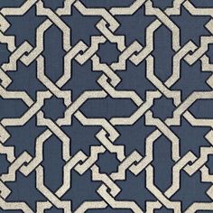 a blue and white rug with an intricate design on the bottom half of it's surface