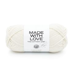 the cottony one made with love yarn is white and has a black logo on it