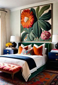 a bedroom with a large painting on the wall above the bed and colorful pillows in front of it