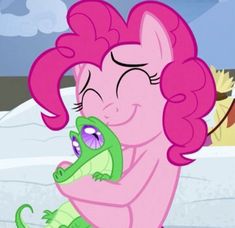 pinkie and her baby alligator hugging in the snow