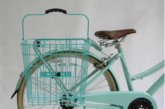 a blue bicycle with a basket on the front