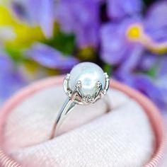 Pearl Ring - Pearl Promise Ring - Freshwater Pearl Ring - Pearl Jewelry - Purity Ring - June Birthstone Ring - White Pearl Ring -Dainty Ring Specifications:-  ❥ Stone - Natural Water Fresh Pearl  ❥ Stone Size - 10x10mm ❥ Cut Type - Emerald Cut  ❥ Accent Stones - Simulated Diamond Cz  ❥ Ring Size: I offer more than one (Contact us if your ring size is not available in the listing) ❥ Color: Silver, Gold, Rose Gold, White Gold or Black Rhodium ❥ Material : 925 Sterling Silver, 14K/18K/22K Solid Gol Luxury White Pearl Promise Ring, White Gold Pearl Ring For Promise, White Gold Pearl Promise Ring, White Gold Pearl Ring With Halo Setting For Promise, White Solitaire Pearl Promise Ring, Pearl Promise Ring With Halo Setting, White Gold Pearl Promise Ring With Center Stone, Promise Pearl Ring, White Gold Round Cut Pearl Promise Ring