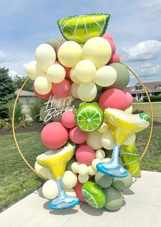 a bunch of balloons that are in the shape of a lemonade and margarita cocktail glasses