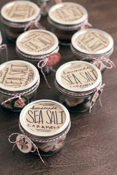 sea salt in glass jars tied with twine and string on wooden table top, ready to be used as gift