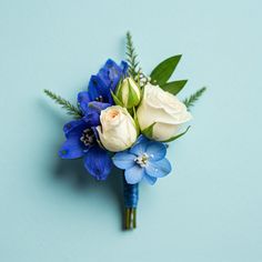 a blue and white boutonniere on a blue background