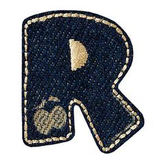 the letter k is made out of blue jeans with gold thread and sequins