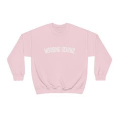 Great for any Nursing student, alumni, teacher, or aspiring scholar! Our unisex heavy blend crew neck sweatshirt is the perfect combination of comfort and style.     50% cotton + 50% polyester (fiber content may vary for different colors)  Medium heavy fabric With no side seams, there are no itchy interruptions under the arms Shoulders are taped for improved durability Ribbed knit collar  Classic unisex fit and runs true to size  Tear away label  Printed in the USA Varsity Long Sleeve T-shirt For School, Long Sleeve Cotton T-shirt With University Logo, Pre-shrunk Varsity Sweatshirt For School, Varsity Style Pre-shrunk Sweatshirt For School, School Varsity Sweatshirt, Long Sleeve Branded T-shirt For College, Long Sleeve College T-shirt With Branding, Fall Letter Print Sweatshirt For College Events, University Logo Long Sleeve Cotton T-shirt