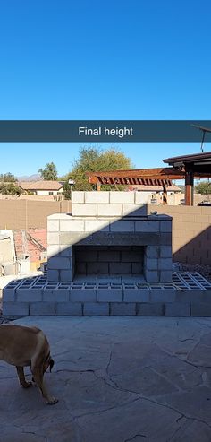 DIY Outdoor Fireplace in Arizona Backyard with cinderblock. Landscape rock and dirt construction zone. Block wall behind fireplace.  Dog and flagstone in picture. Daylight shadow over structure. Block Fireplace Outdoor, Diy Outdoor Stone Fireplace, How To Build Outdoor Fireplace, Diy Outdoor Fireplace Easy, Diy Backyard Fireplace, Master Courtyard, Small Outdoor Fireplace, Outdoor Fireplace Area