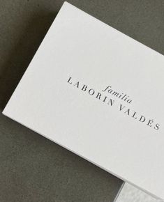 a white business card sitting on top of a table