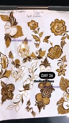 some gold flowers and leaves on white paper with the words, day 26 online class