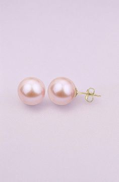 Lustrous 7.5-8.0mm pink freshwater cultured pearls shimmer elegantly in these timeless women's stud earrings. Fashioned in 14K yellow gold, the earrings secure in place with friction backs. Jared The Galleria Of Jewelry, Womens Earrings Studs, Creative Background, Freshwater Cultured Pearls, Pearl Stud Earrings, Pearl Studs, Cultured Pearls, Fresh Water, Yellow Gold